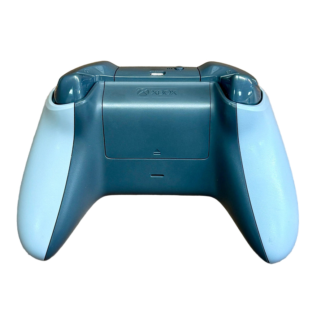 Microsoft Xbox One Wireless Controller - Grey/Green Blue Xbox gaming controller on a textured surface