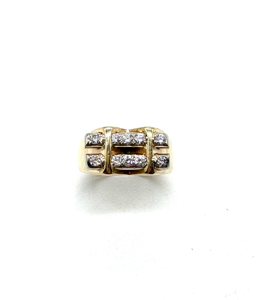Gold ring with diamond accents on a white background