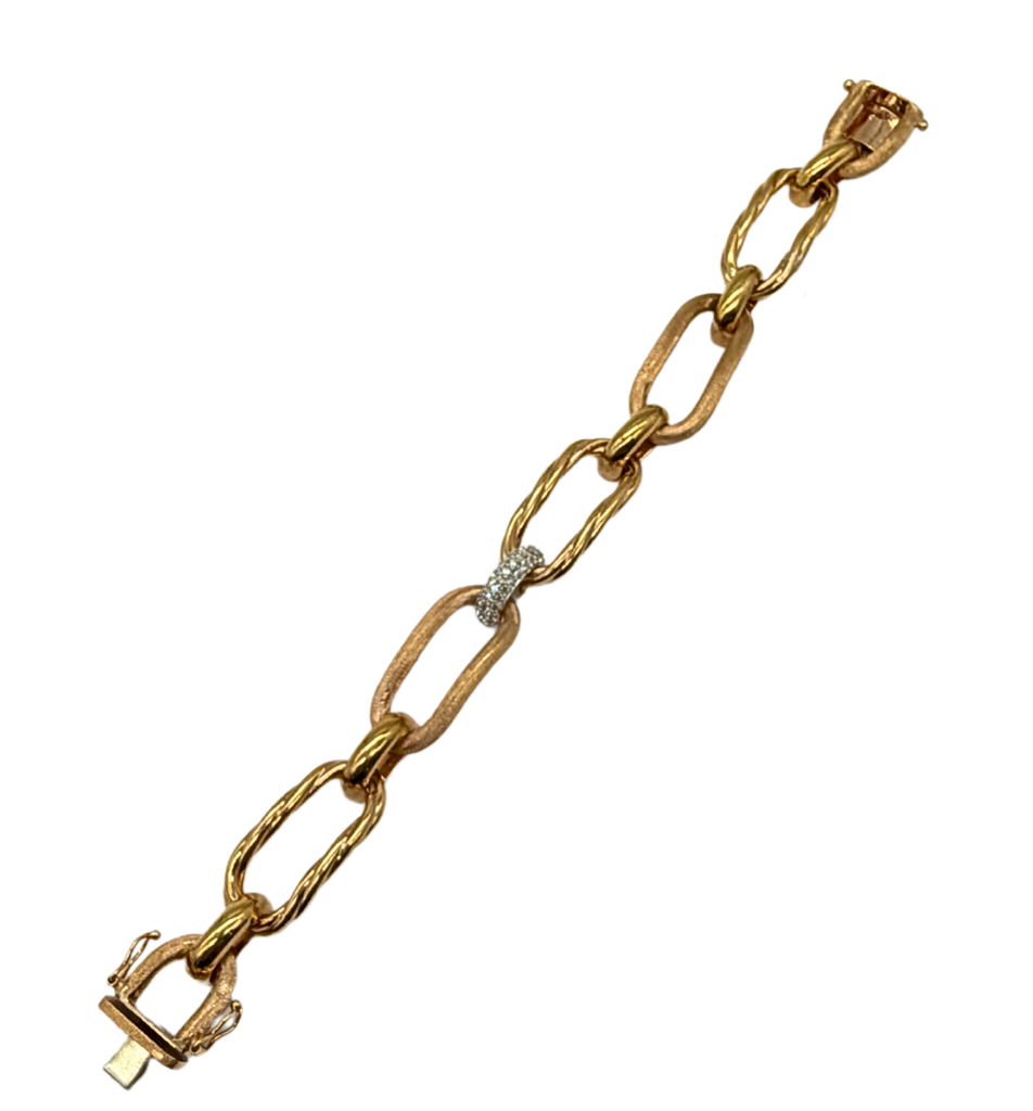 Gold chain bracelet with a diamond clasp on a white background
