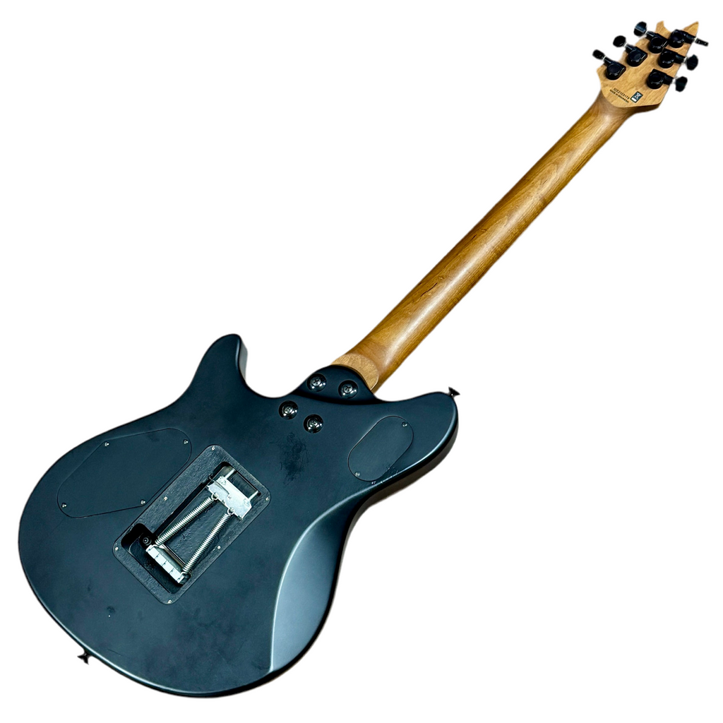 EVH Wolfgang WG Standard Electric Guitar Electric guitar with a black body and wooden neck on a white background