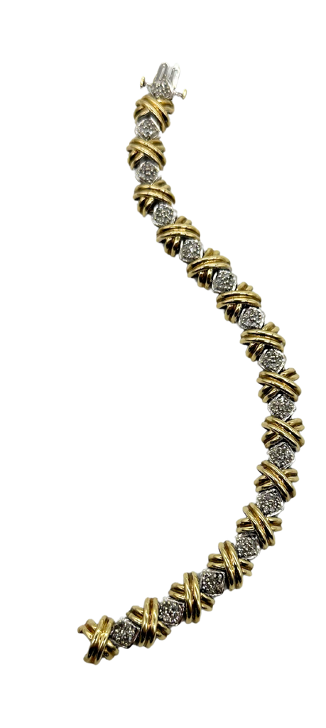 Gold and silver bracelet on a white background