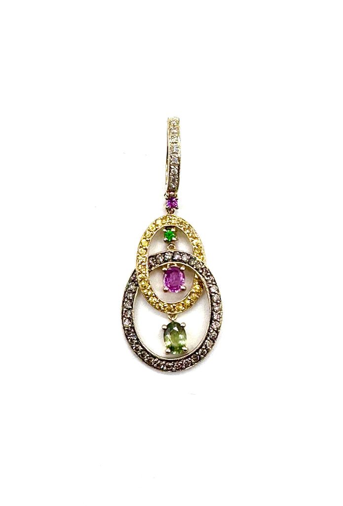 Gold pendant with gemstones on a white background