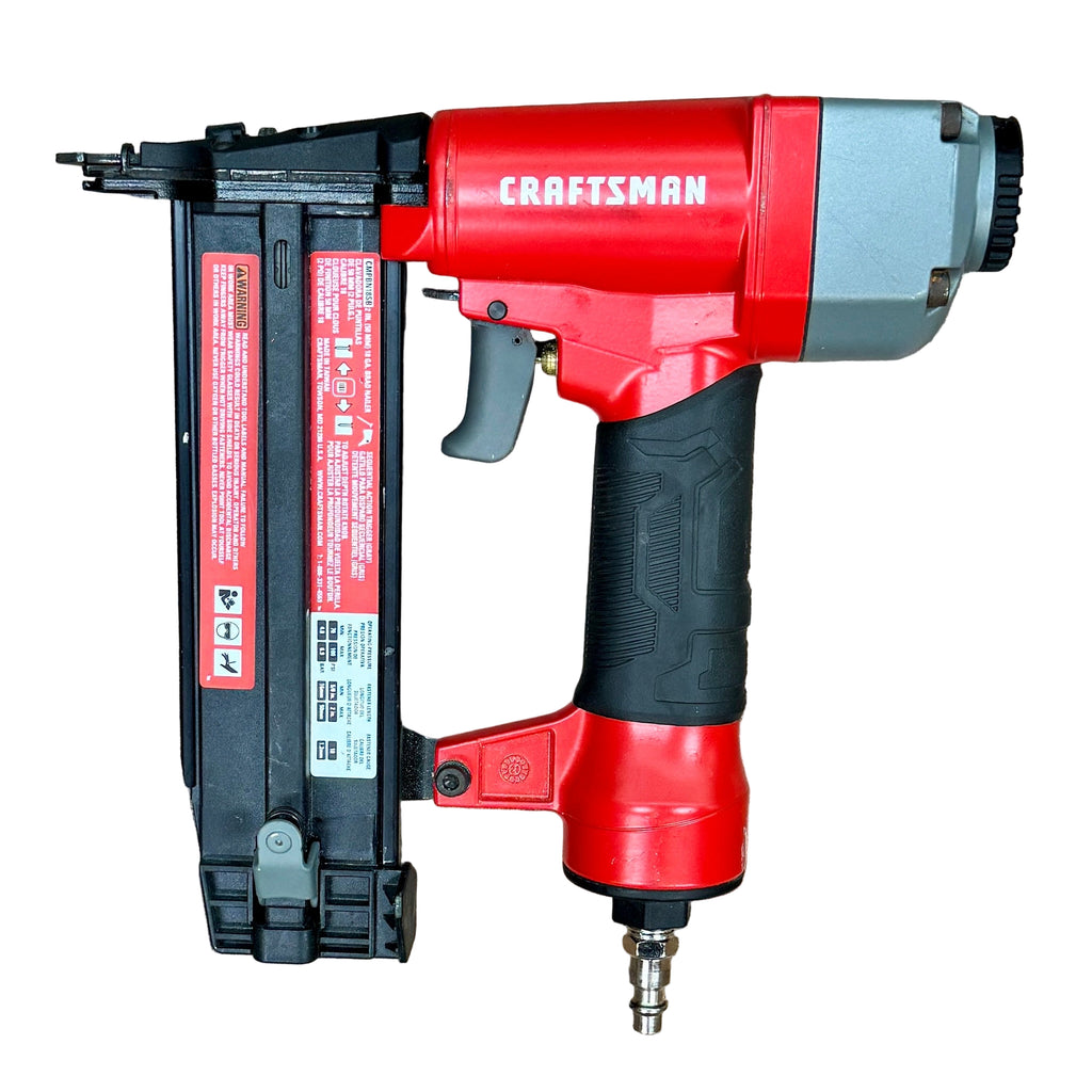 CRAFTSMAN 18-Gauge 2" Pneumatic Brad Nailer (CMPBN18SB) Red and black Craftsman nail gun on a wooden surface
