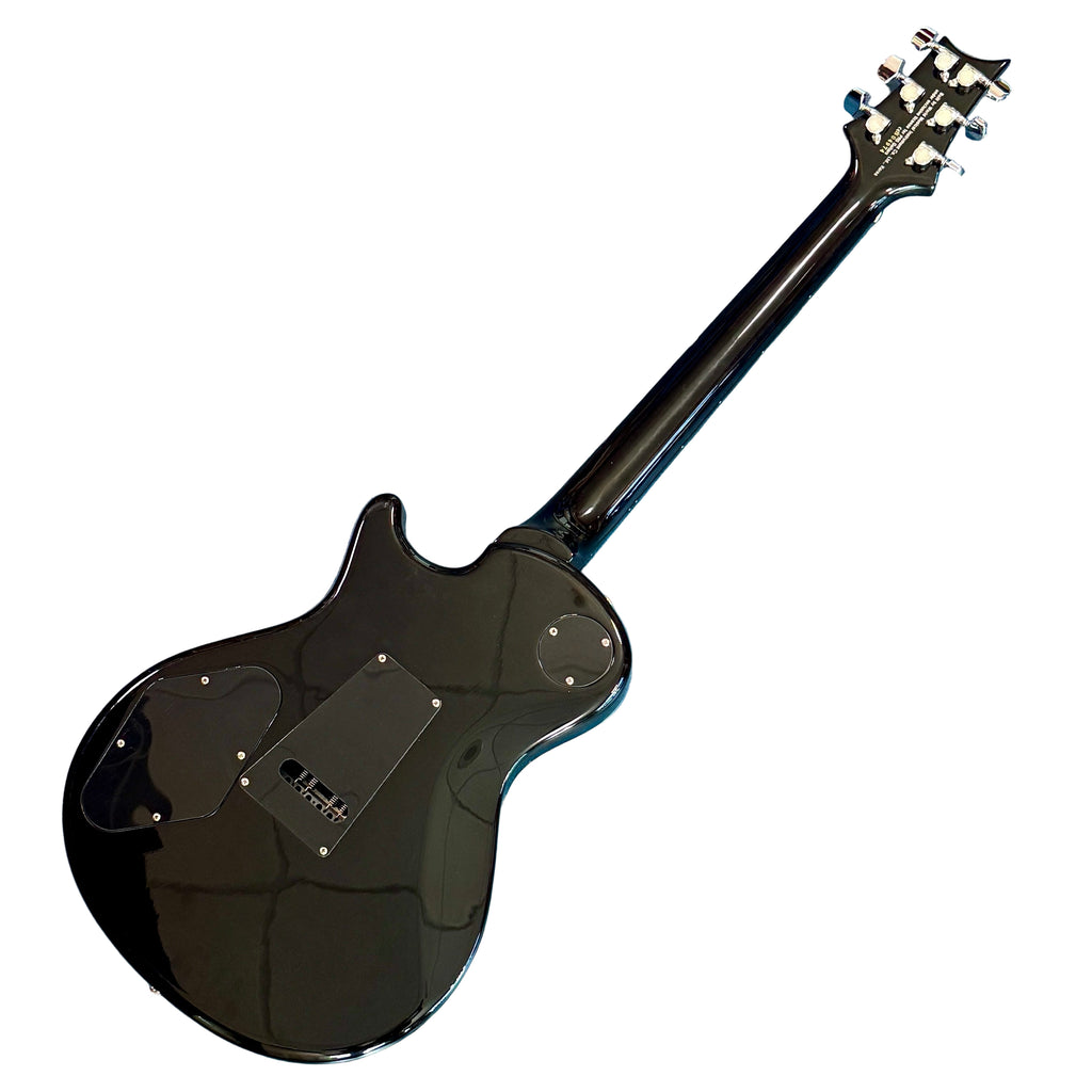 Paul Reed Smith PRS SE Tremonti Electric Guitar w/ Hard Case Black electric guitar on a blue textured surface