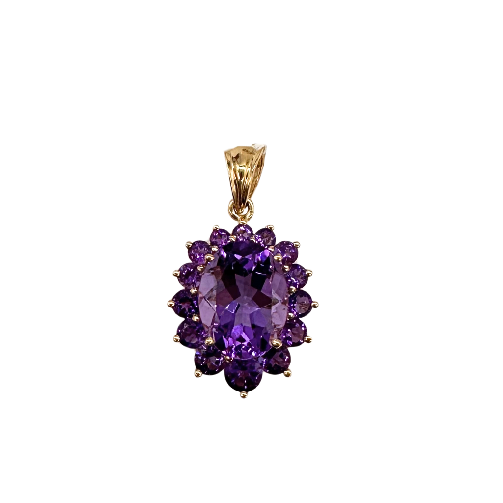 Purple gemstone pendant on a gold chain against a white background