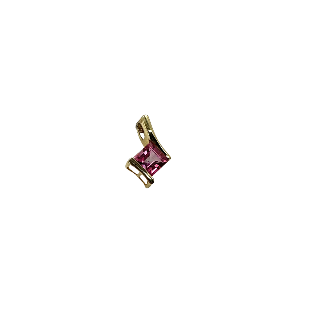 Gold pendant with a pink gemstone on a white background