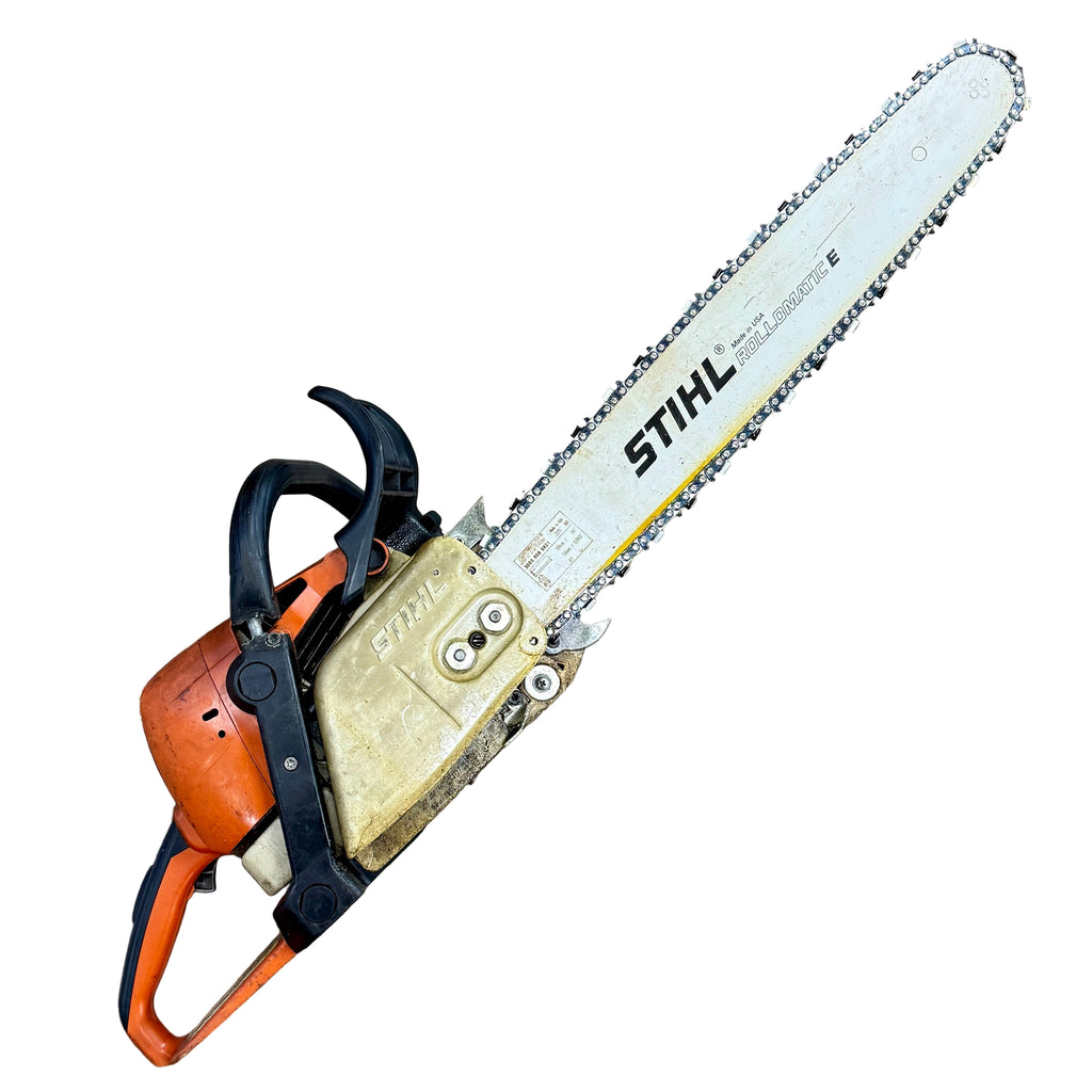 STIHL MS 310 59 cc 20" Guide Bar Gas-Powered Chainsaw Stihl gas chainsaw on a wooden floor