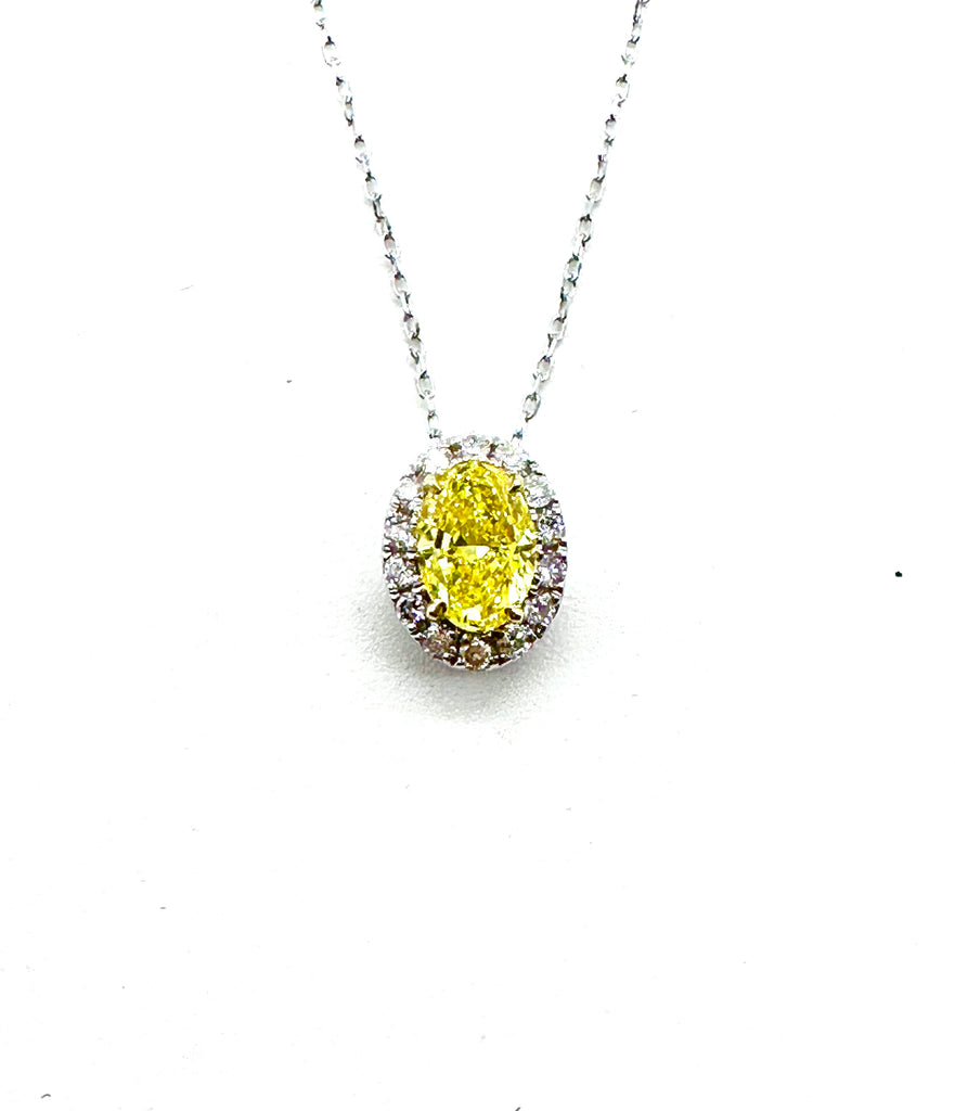 Yellow diamond pendant on a white chain against a white background