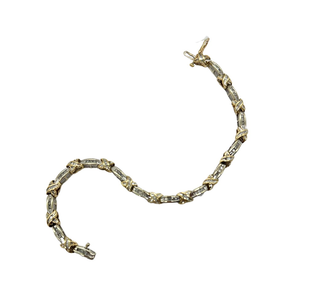 Gold bracelet with gemstones on a white background