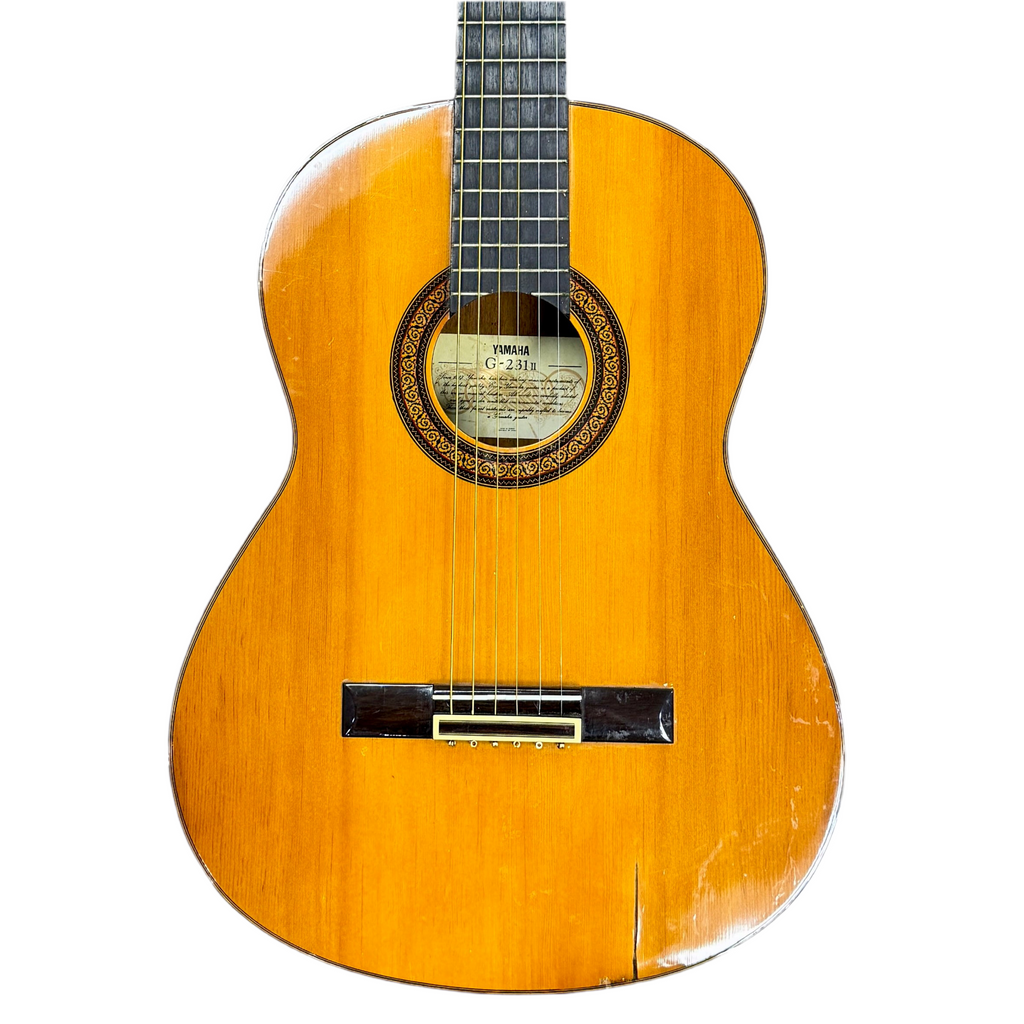 Wooden acoustic guitar on a white background