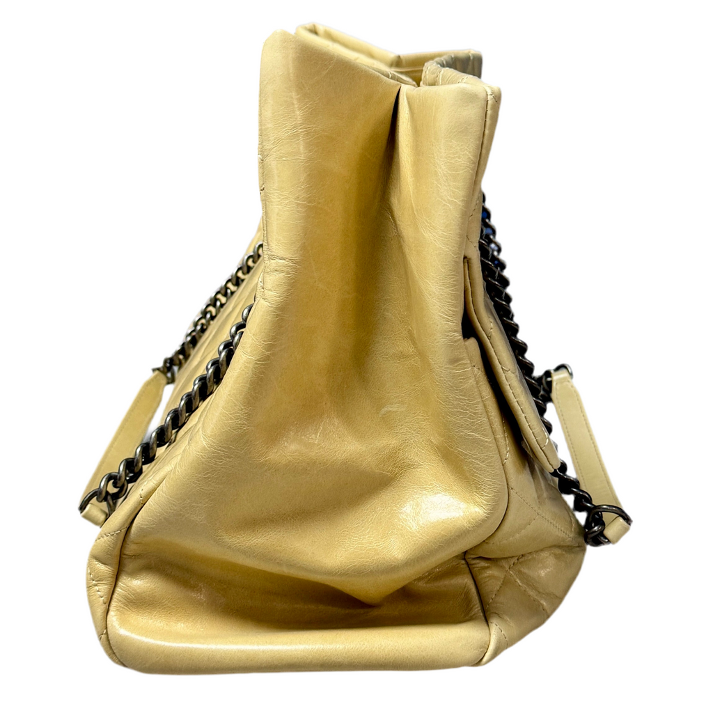 CHANEL Glazed Calfskin Leather Quilted Small Duo Color Tote Bag - Beige handbag with black chain details on a white background