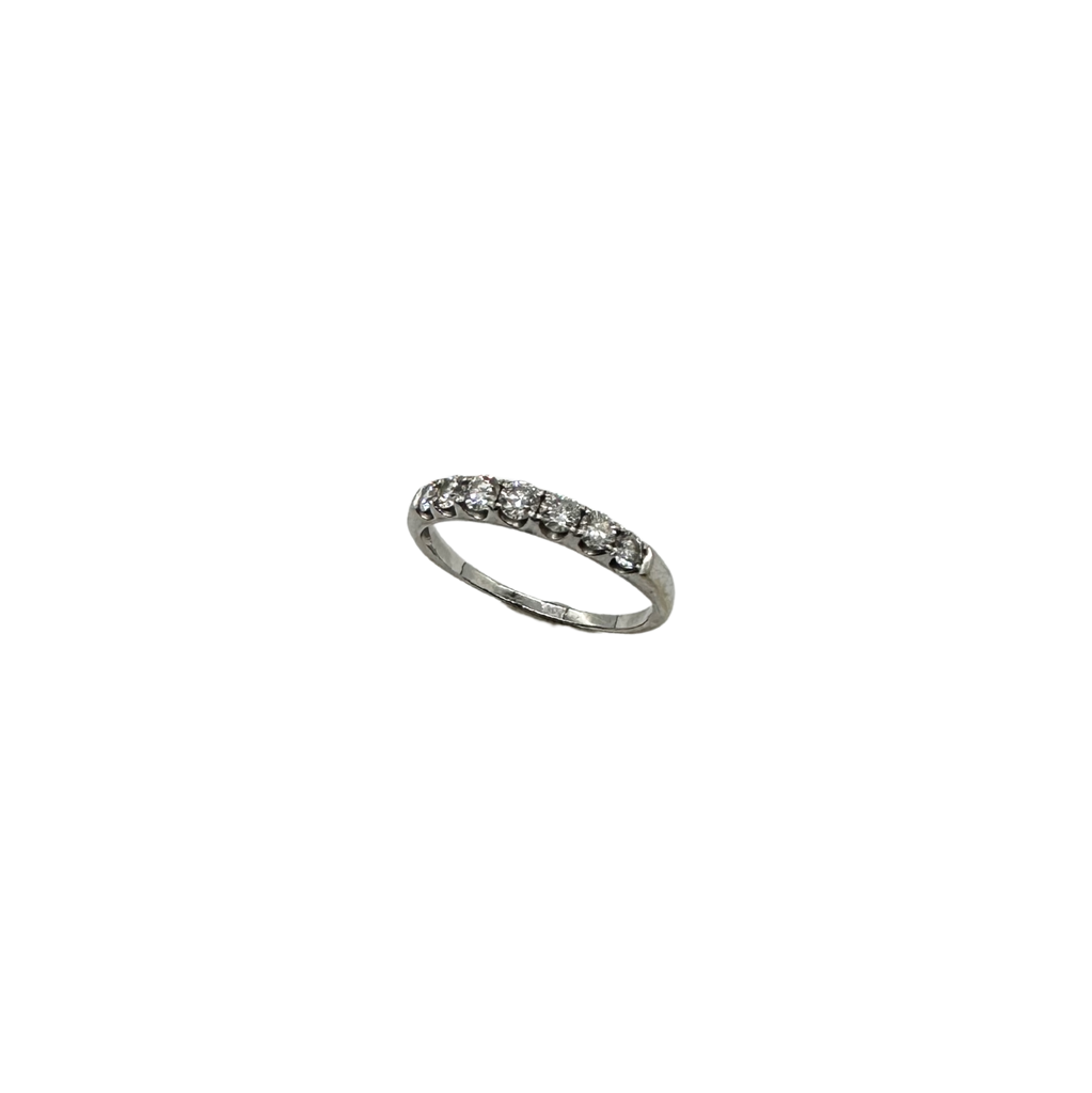 Silver ring with small diamonds on a white background