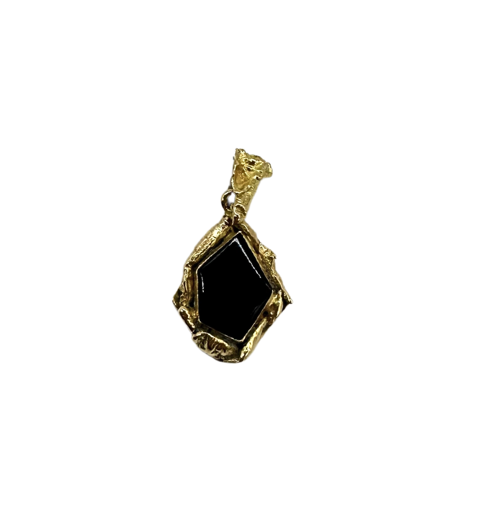 Gold pendant on a clear background