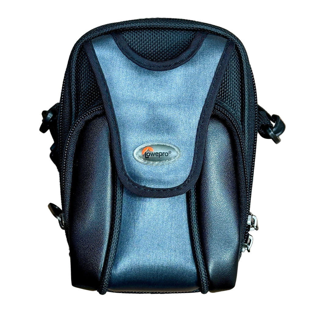 Canon PowerShot A1100 IS 12.1 MP Digital Camera w/ Case - Silver Black camera bag with a visible brand logo on a wooden surface