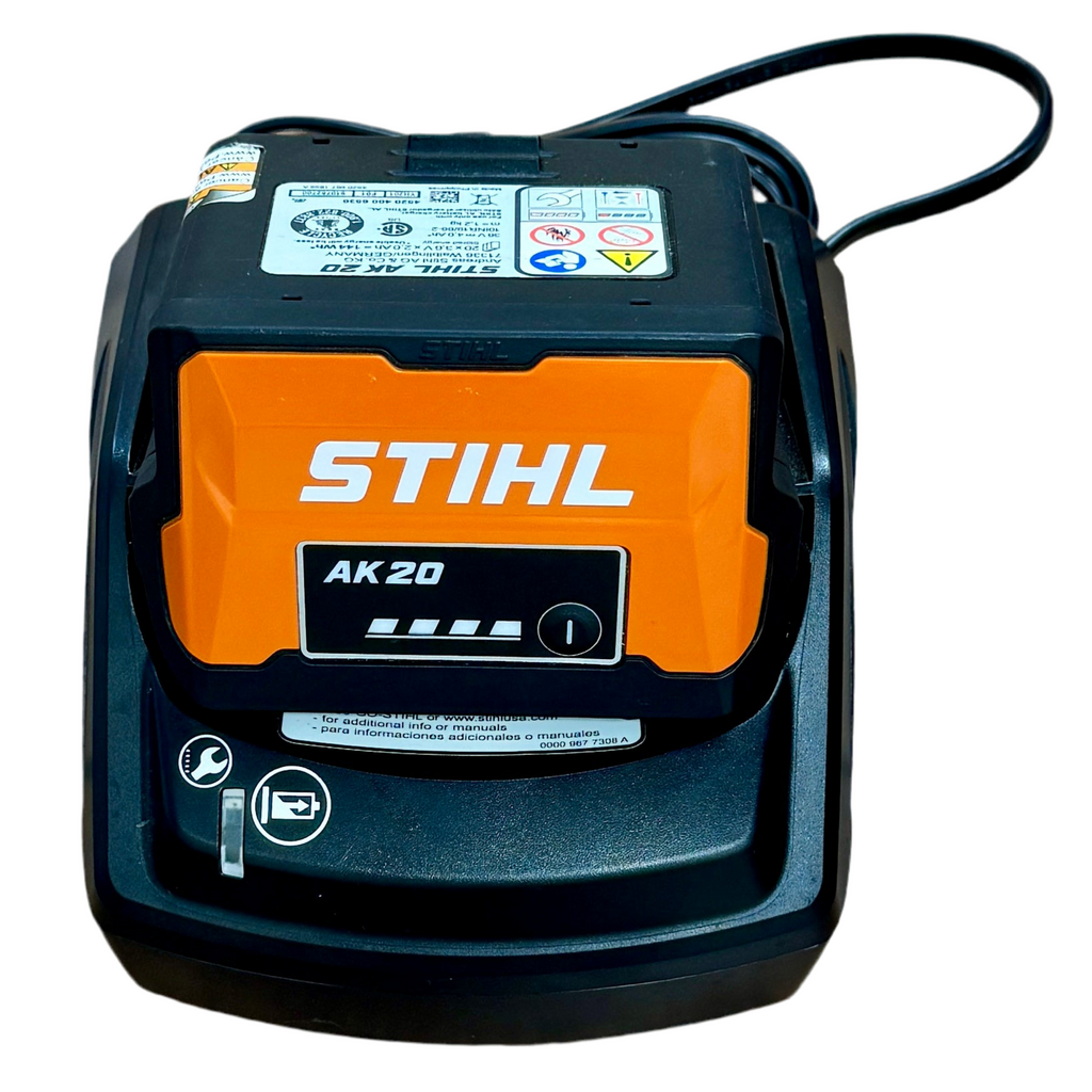 STIHL 36V 1/4" Chain 12" Bar Battery-Powered Chainsaw w/ Battery & Charger (MSA 120C) Stihl battery charger with orange and black design on a white background