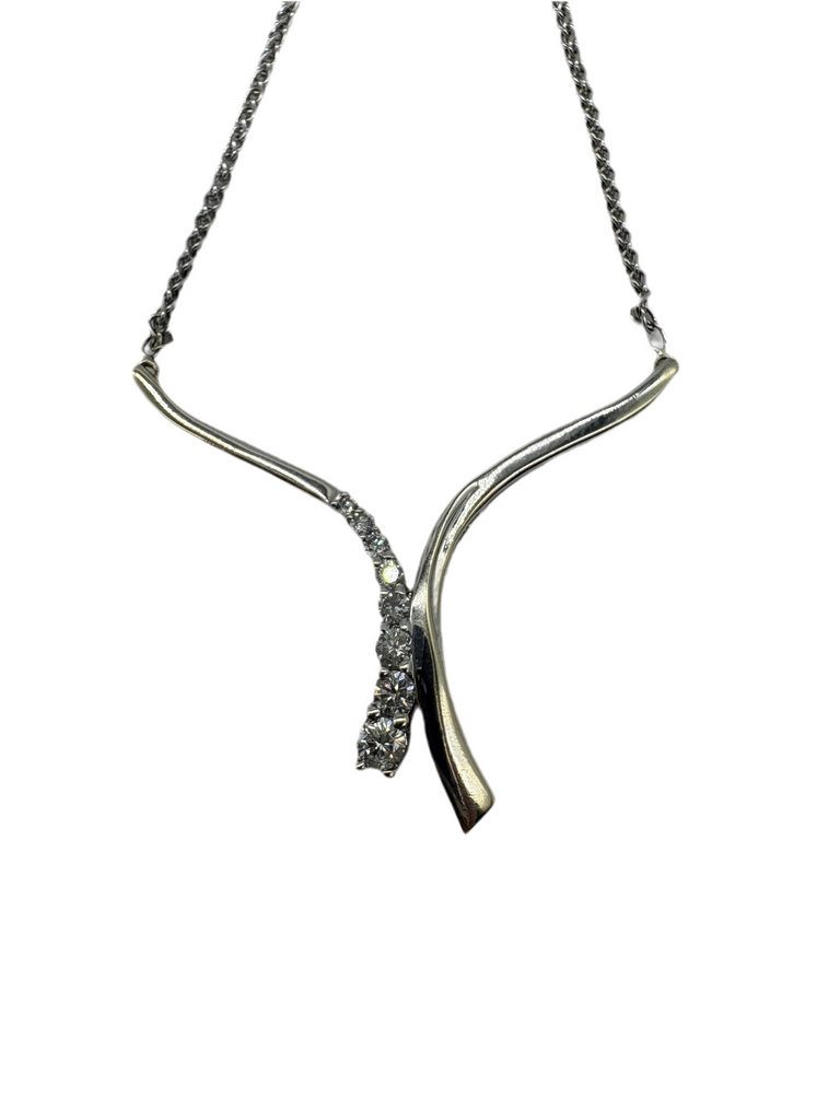 Silver necklace with a unique design on a white background