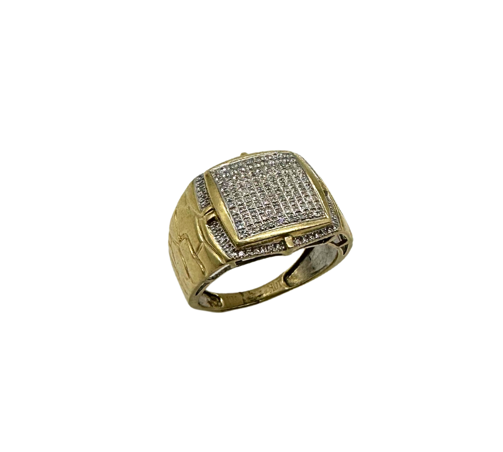 Gold ring with diamond-studded band on a white background