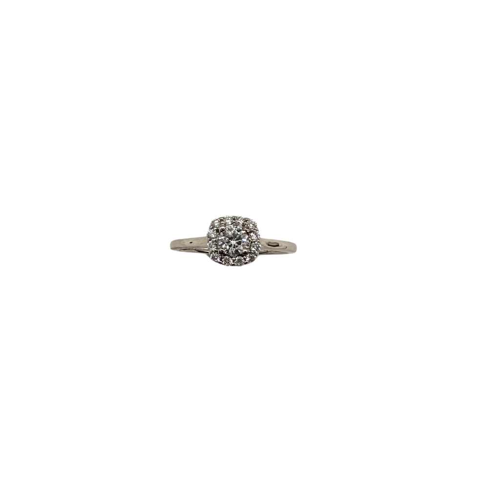 Silver ring with a central gemstone on a white background
