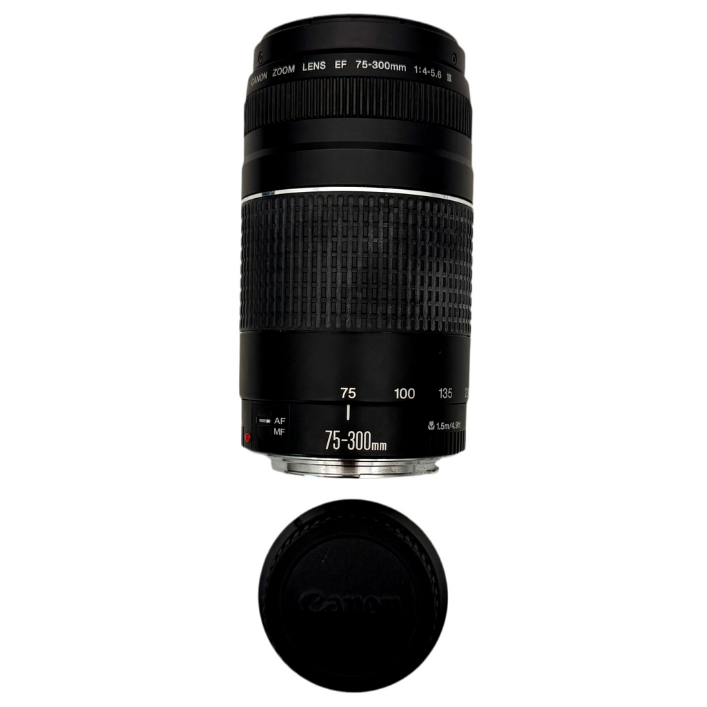 Canon EOS Rebel T3 12.2 MP CMOS Digital SLR Camera w/ Canon Zoom Lens EF-S 18-55mm f/3.5-5.6 IS II & Canon Zoom Lens EF 75-300mm f/4-5.6 III Lenses Camera lens with focus ring and hood on a white background