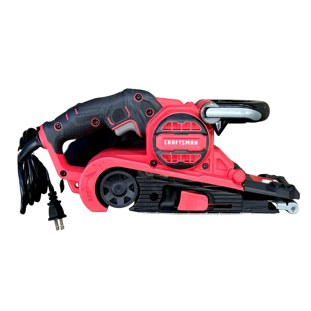 CRAFTSMAN 7-Amp 3" x 21" Corded Belt Sander (CMEW213) Red and black Craftsman belt sander on a wooden surface