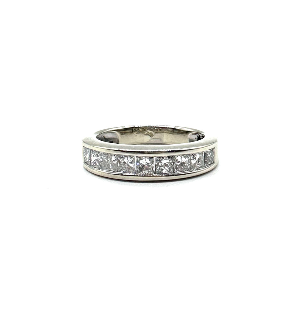 Silver ring with diamond stones on a white background