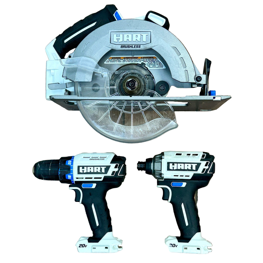 HART 20V 7-1/4" Brushless Cordless Circular Saw / HART 20V 1/2" Cordless Drill/Driver / HART 20V 1/2" Cordless Impact Driver w/ 2 Batteries, Charger, & Carrying Case (HPCS25/HPDD25VN/HPID25VN) Hart power tools including a circular saw and two impact drivers on a wooden floor.