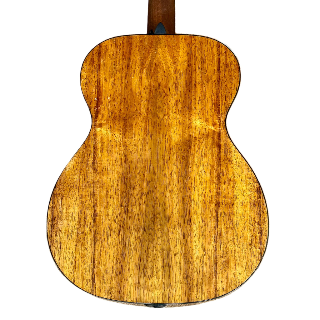Martin Road Series 000-12E Acoustic-Electric Guitar w/ Soft Case Wooden acoustic guitar on a tiled floor