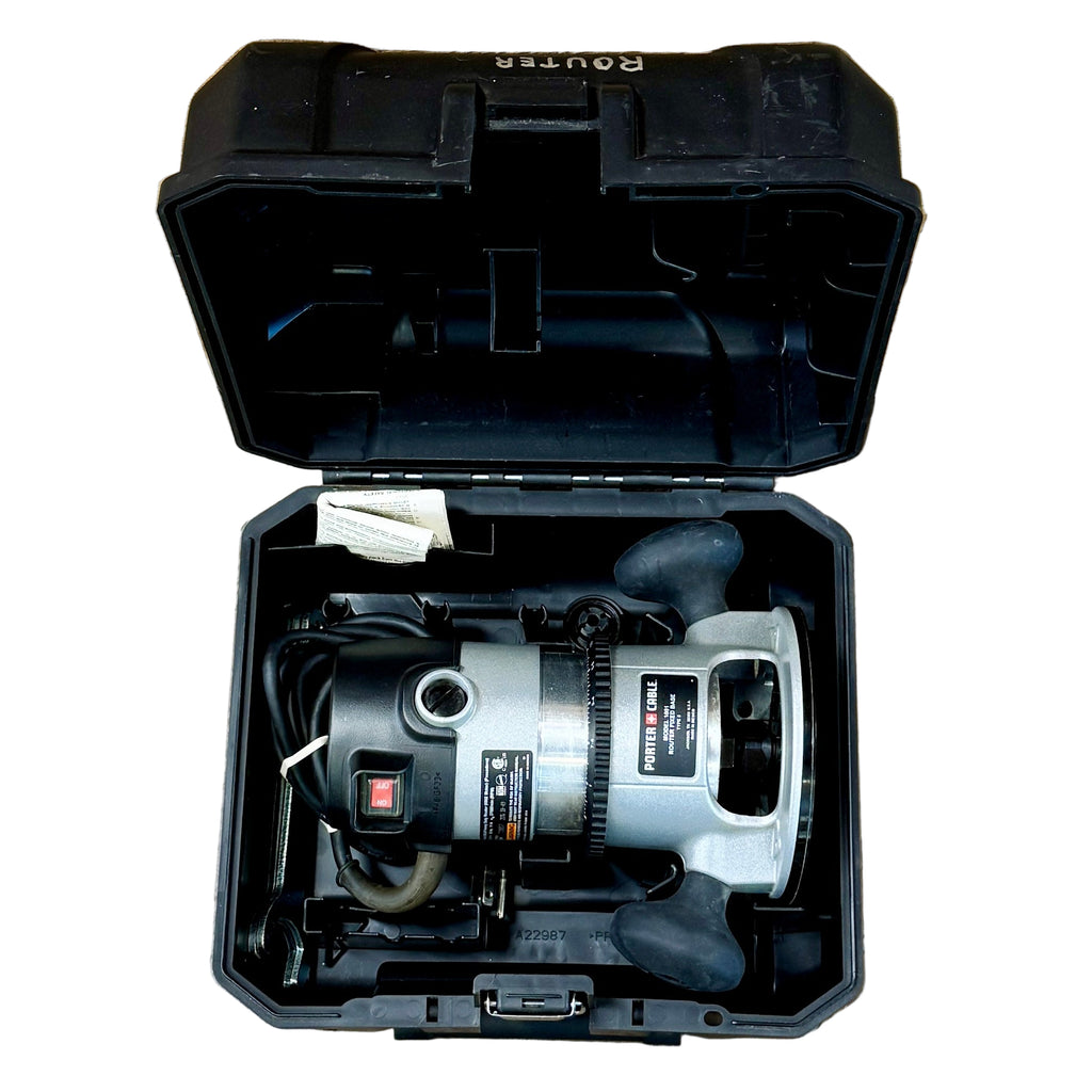 Porter-Cable 11-Amp 1-3/4 HP Corded Fixed-Based Router w/ Hard Case (690LR) Circular saw in a black case on a wooden floor