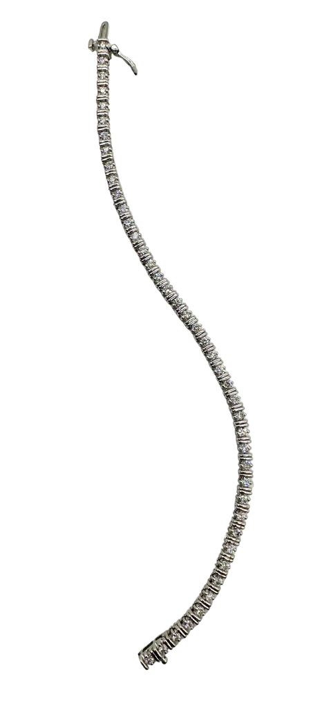Silver necklace with small beads on a white background