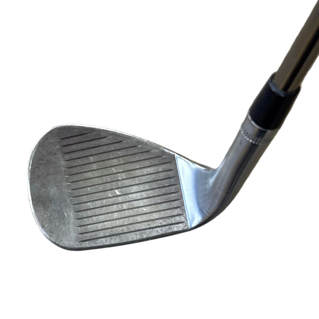 Callaway JAWS RAW 60-Degree Wedge RH Golf Club Golf club on a wooden floor with a yellow object in the background