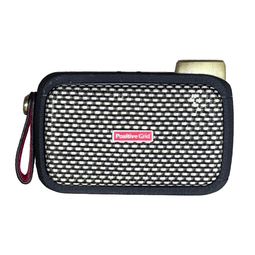 Positive Grid Spark GO 5W Ultra-Portable Smart Guitar Amplifier & Bluetooth Speaker - Black Small electronic device with a mesh cover and visible brand logo on a white background