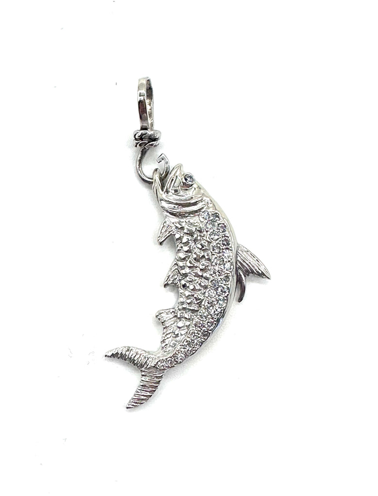 Silver fish pendant on a white background