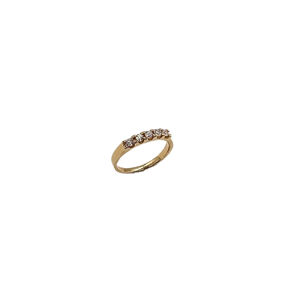 Gold ring with diamonds on a white background