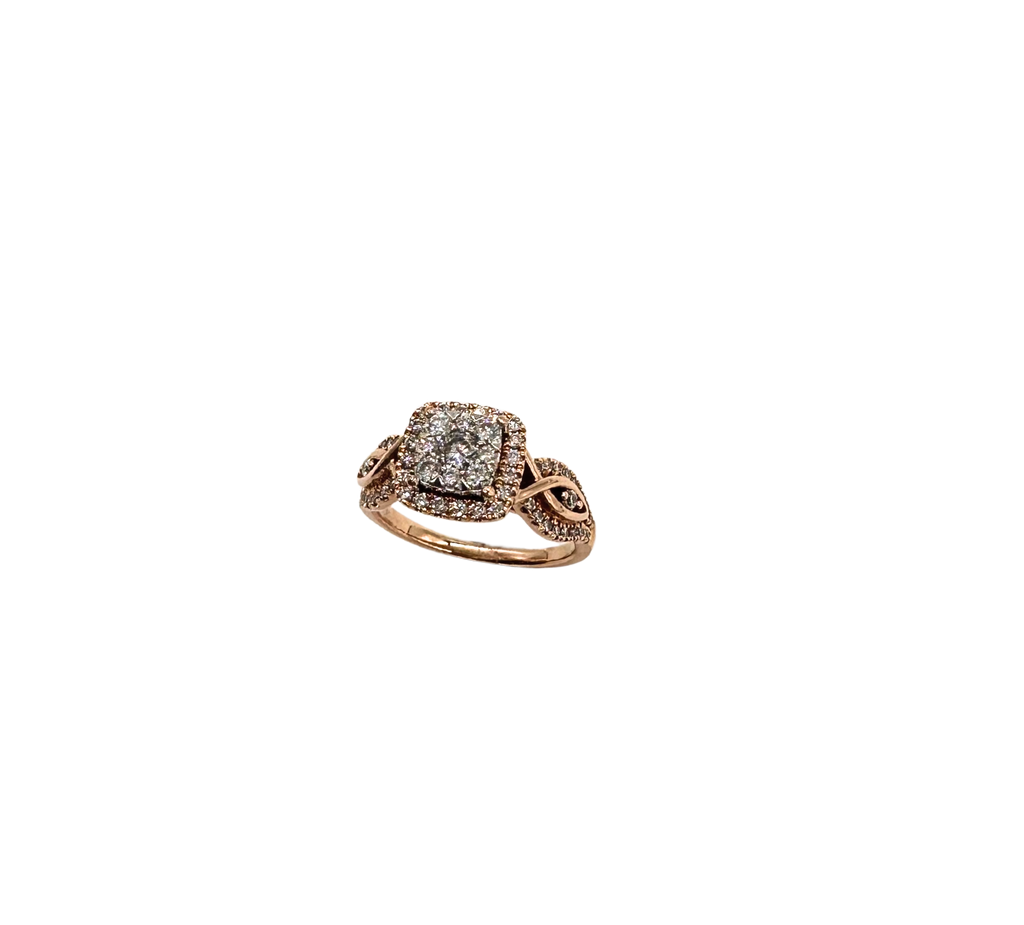 Rose gold ring with diamond accents on a white background