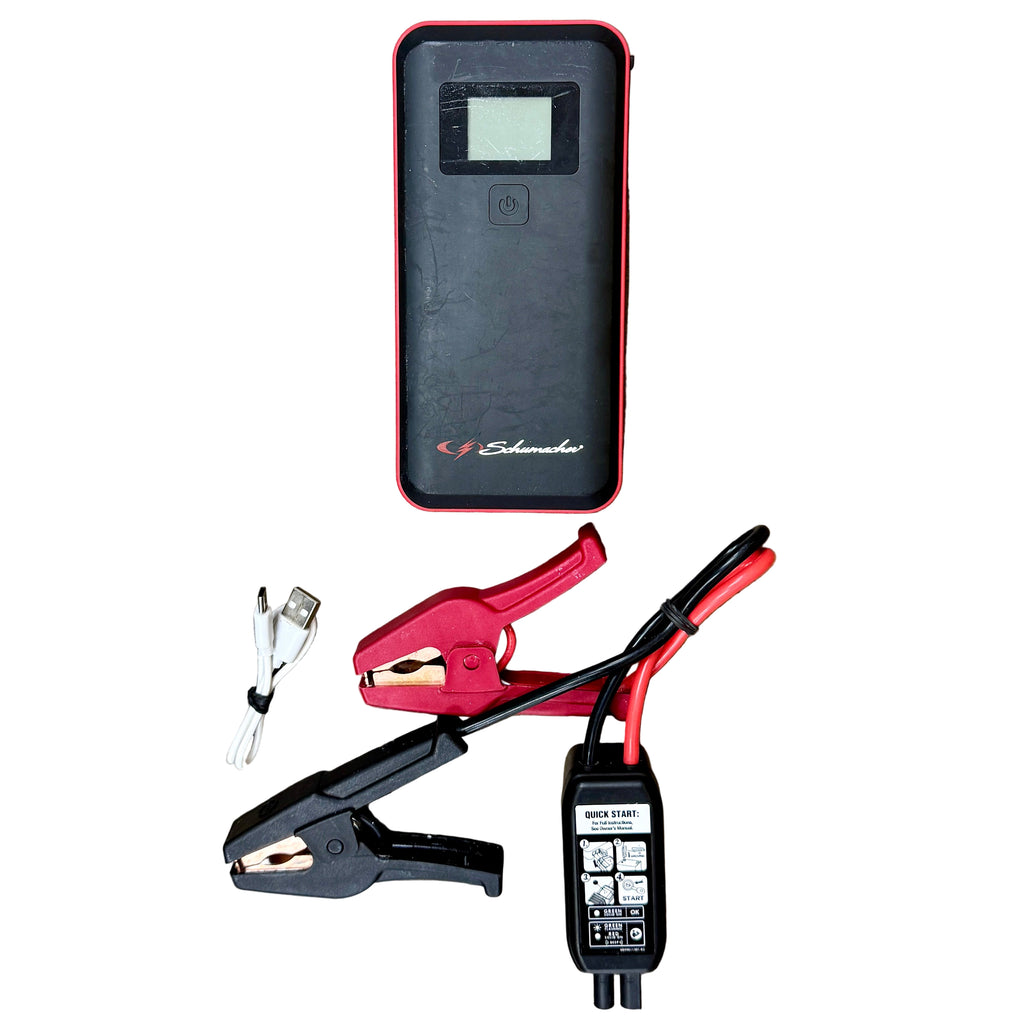 Schumacher Electric 1200A 12V Lithium Jump Starter & Power Pack (SL1582) Schumacher jump starter on a wooden surface with clamps and cables.