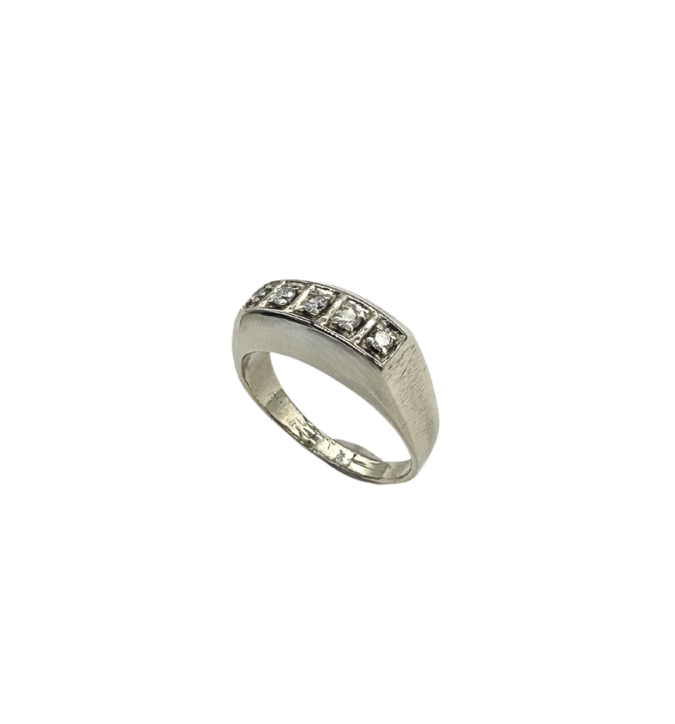 Silver ring with embedded diamonds on a white background