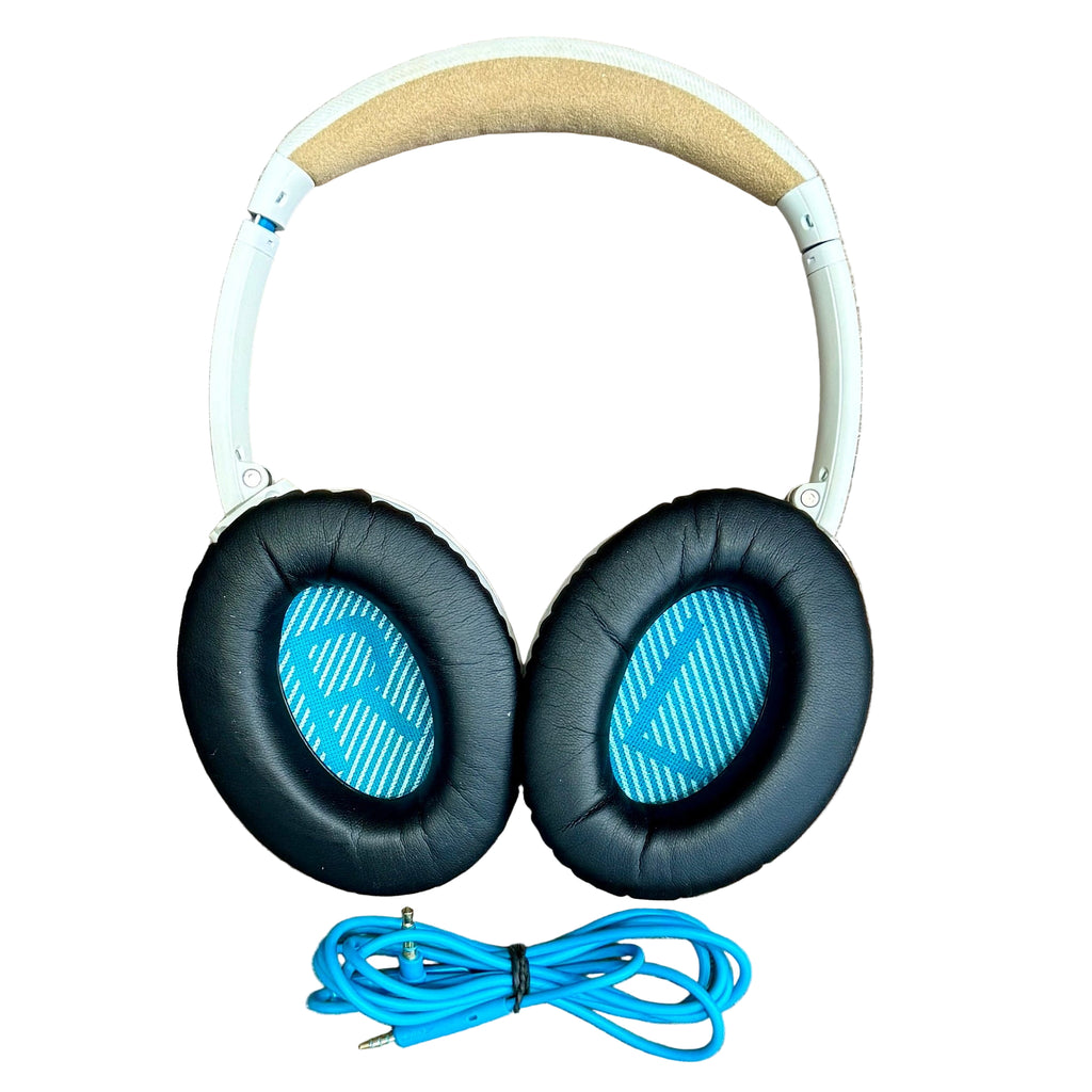 BOSE QuietComfort 25 Acoustic Noise Cancelling Headphones w/ Case - White Headphones with blue ear cushions and cable on a white background