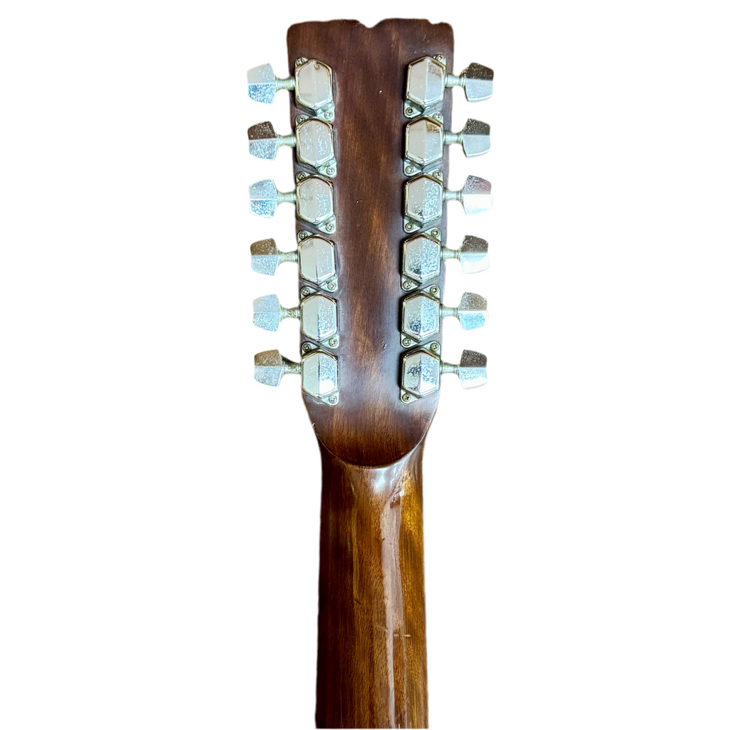 Fender F-55-12 12-String Acoustic Guitar (Strung w/ 6 Strings) Close-up of a guitar headstock with 12 tuning pegs on a white background