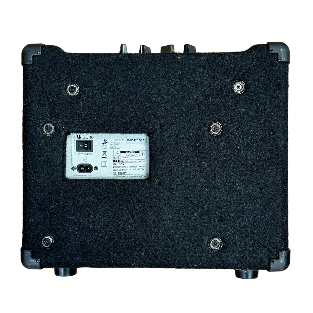 Warwick Amplification BC10 Bass Combo Amplifier Black electronic device with a label on a wooden surface