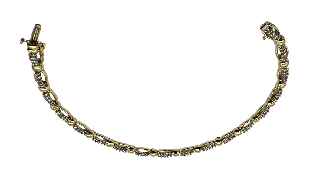 Gold bracelet with small diamonds on a white background