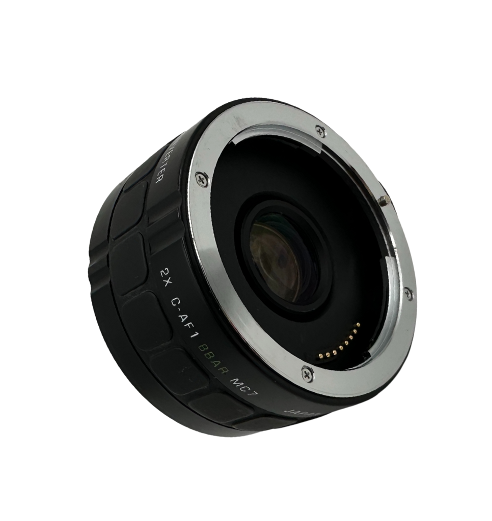 Camera lens with black and silver design on a white background