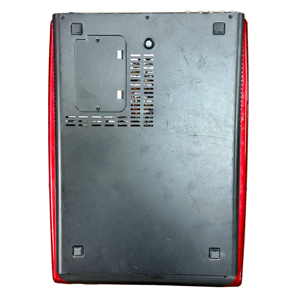 Behringer XENYX UFX1204 Mixer and USB Audio Interface with Effects Back view of a black electronic device with red accents on a wooden surface