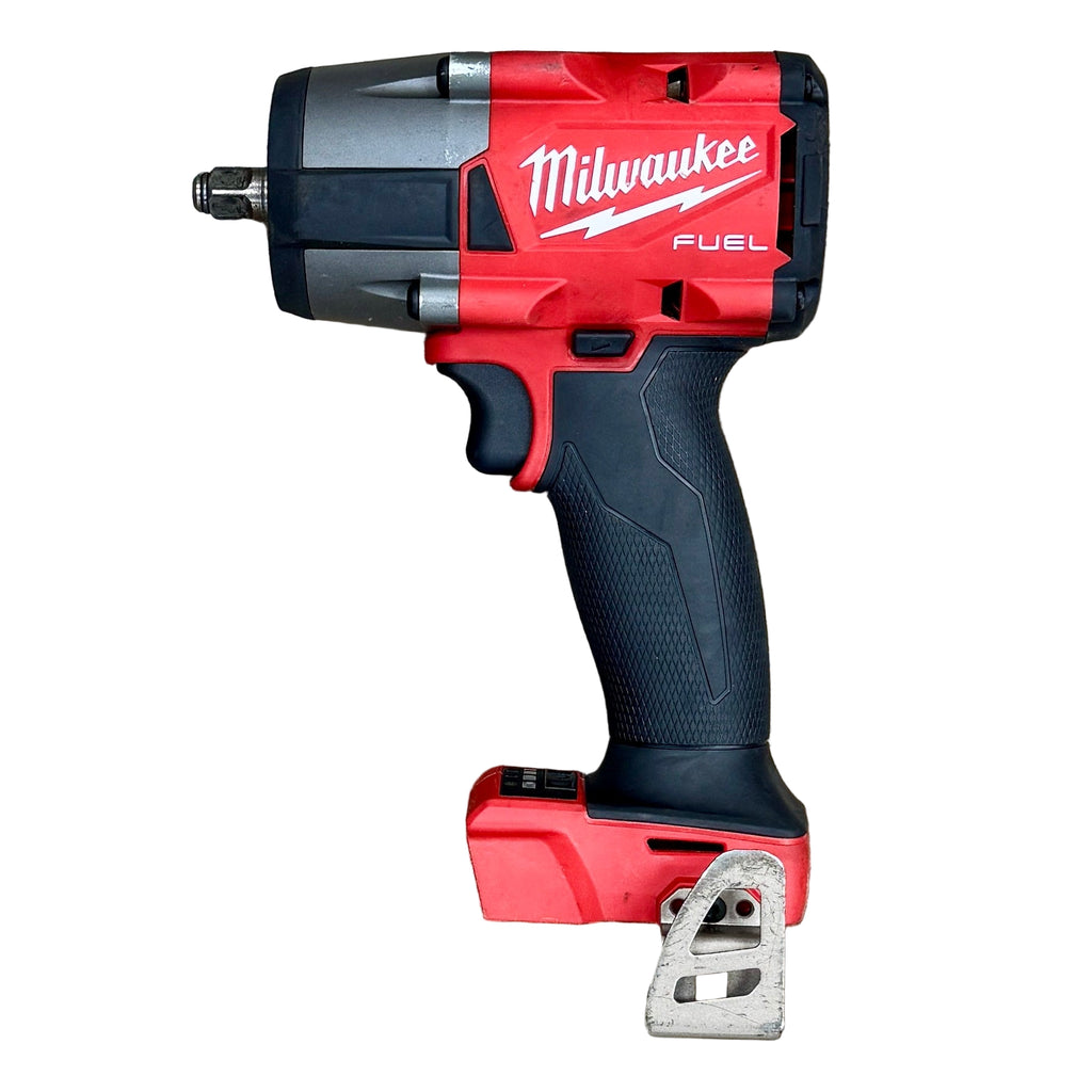 Milwaukee M18 FUEL 18V 3/8" Brushless Cordless Mid-Torque Impact Wrench (2960-20) Red and black Milwaukee power tool on a wooden surface