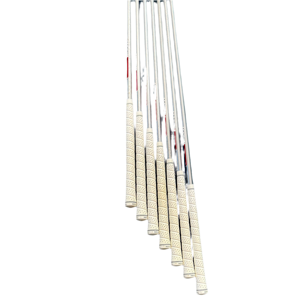 TaylorMade P790 7-Piece Iron Set RH Golf Clubs (4-9, P) Set of golf club shafts with white grips on a white background