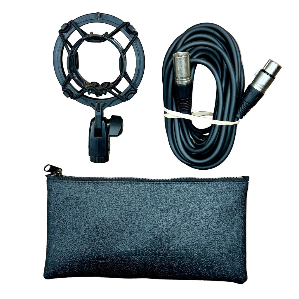 Audio-Technica AT2035 Large-Diaphragm Cardioid Condenser Microphone Black microphone with stand, cable, and pouch on a wooden surface