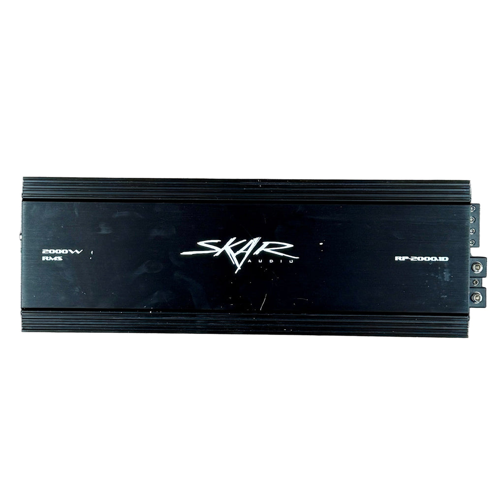 SKAR AUDIO RP-2000.1D 2000 Watt Class D Monoblock Car Amplifier Black amplifier with 'Skar Audio' branding on a tiled floor