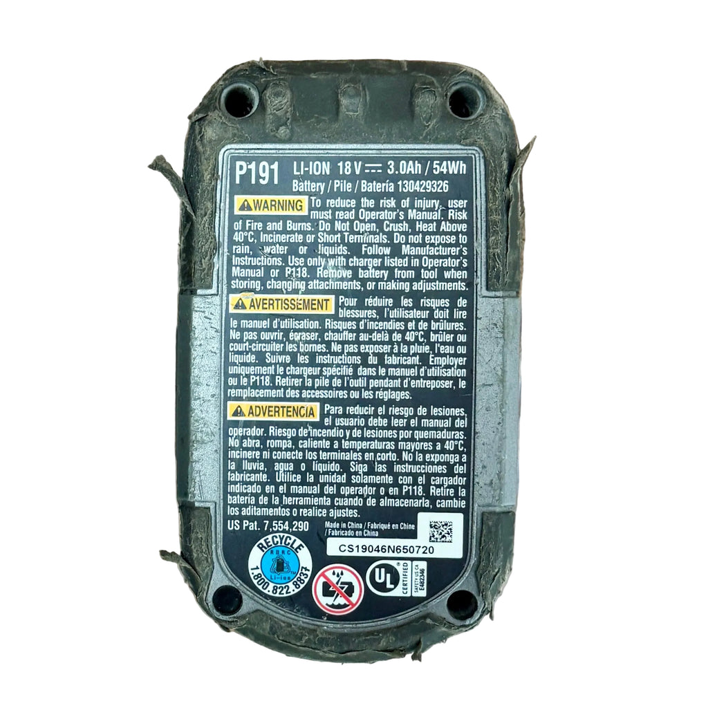 RYOBI ONE+ 18V 3Ah Lithium+ HP Battery Pack (P191) Battery pack with warning labels on a wooden surface