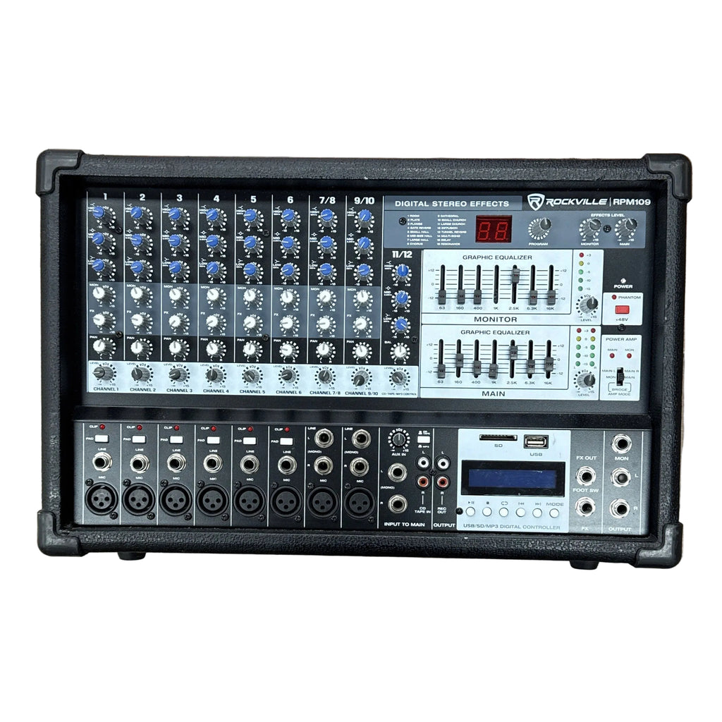 ROCKVILLE Audio RPM109 4800W 12-Channel Powered Mixer Sound mixing console on a wooden floor with a person's feet visible