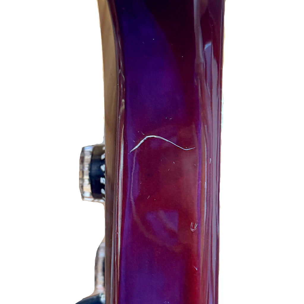 Aria Pro II Thor Sound TS-300 Electric Guitar w/ Hard Case Close-up of a purple bicycle rim with a blurred background