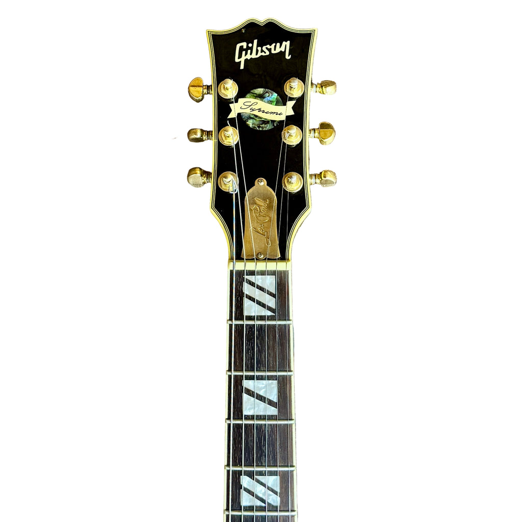 Gibson Les Paul Supreme Electric Guitar w/ Hard Case Gibson guitar headstock on a white background